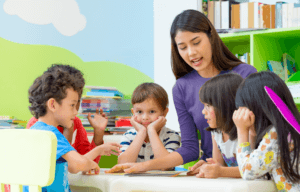 Woman reading with a group of young children