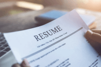 a person is looking at a resume