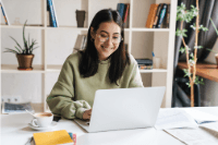 young woman on computer planning for future